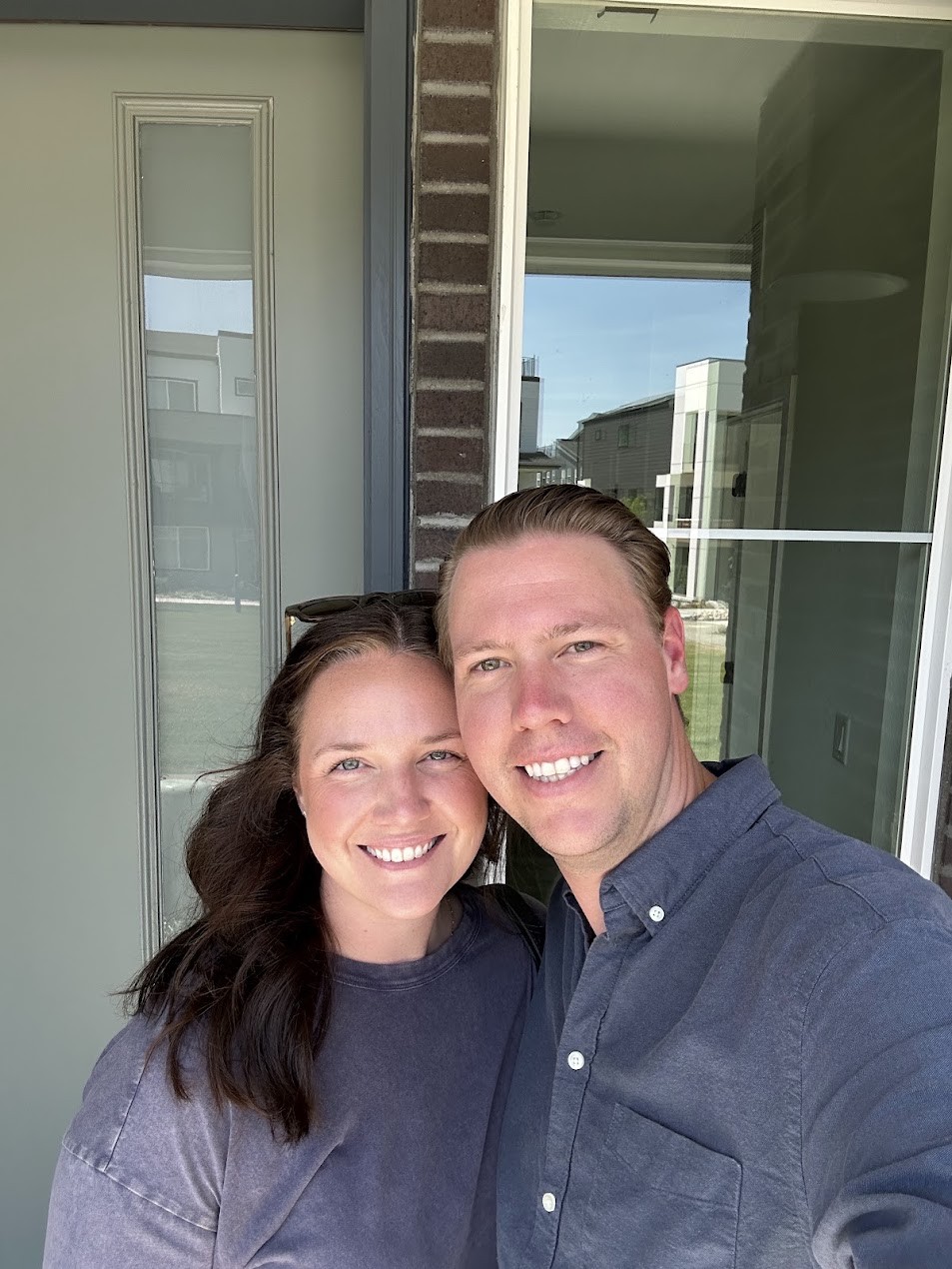 Jackson and his wife in front of their house