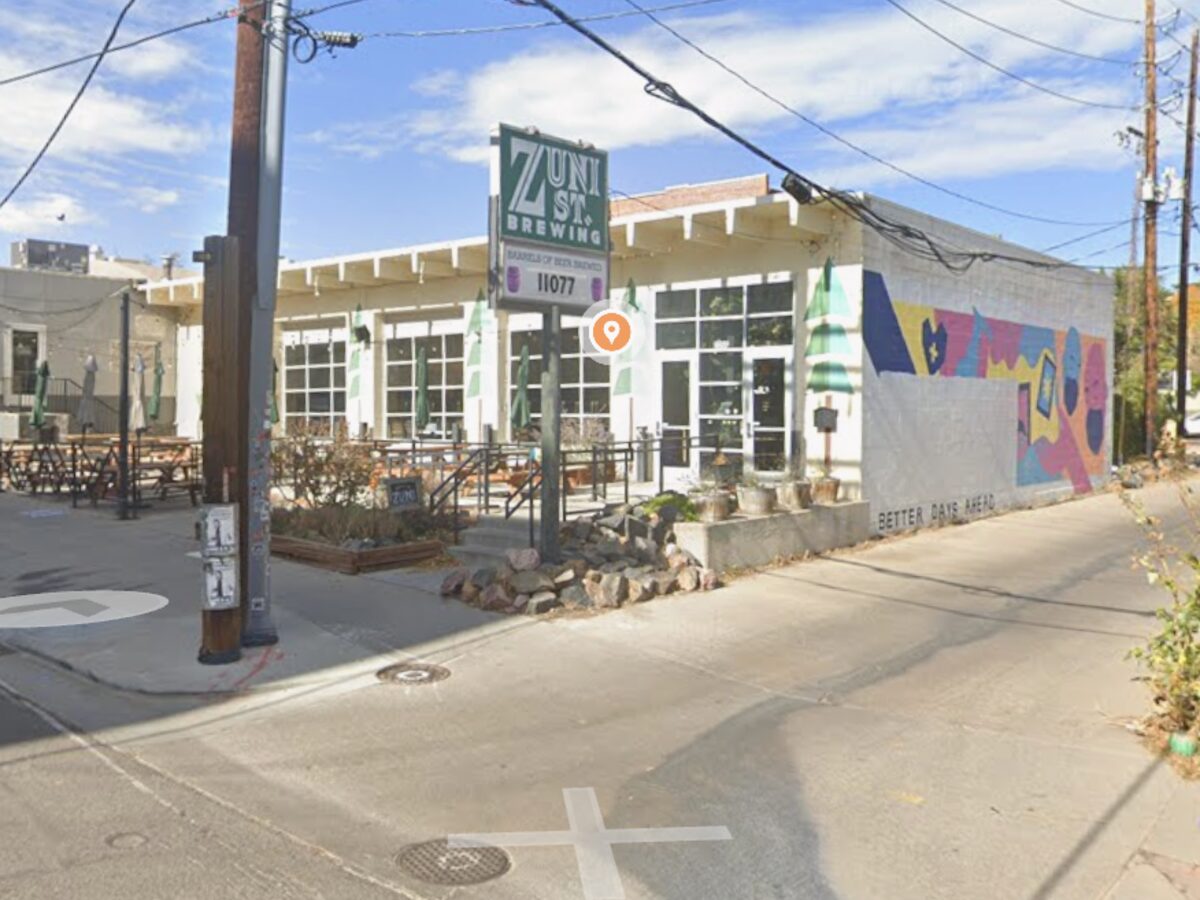 Zuni Street Brewing taproom with patio seating and a painted mural in Denver
